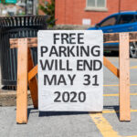 sign says free parking will end in Morgantown